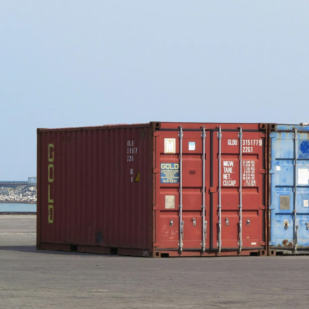 Red and blue shipping containers at port