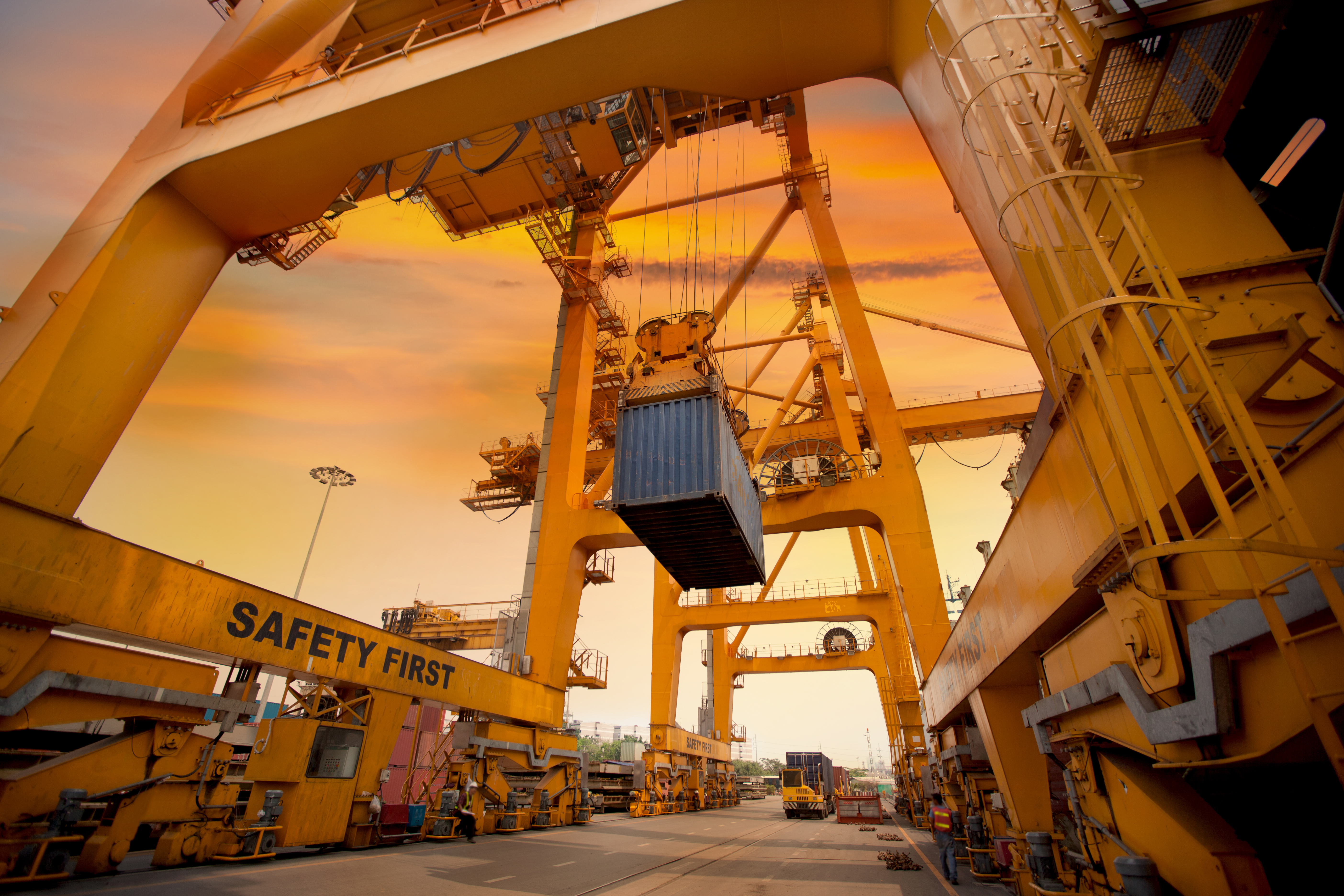Container port operations at sunset